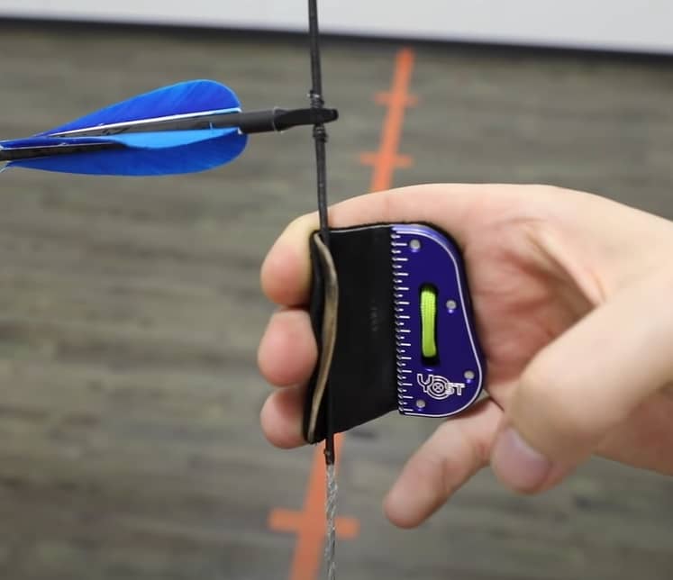 String walking aiming method - Down the string to move your group lower to hit perfectly on the target
